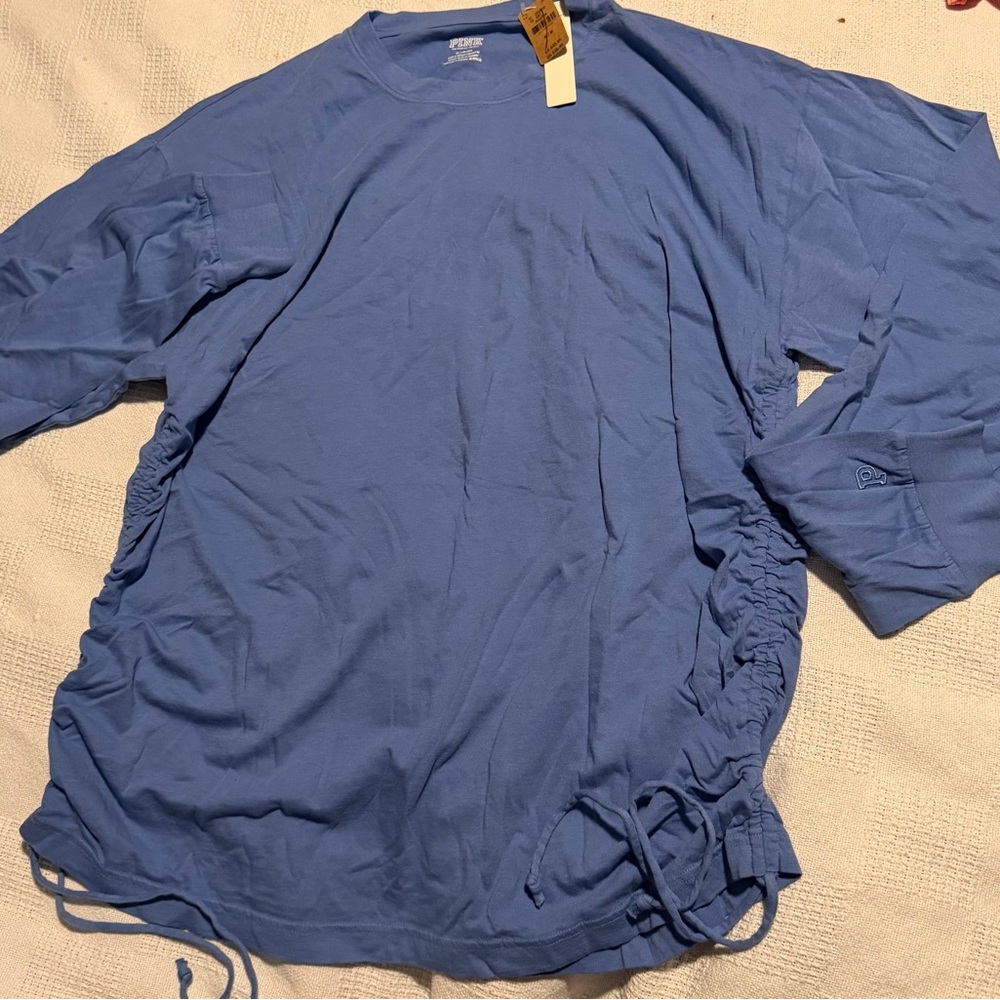 Brand new Victoria's Secret Blue Long Sleeve Top with scrunch tie on sides